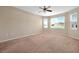 Carpeted bedroom with natural light and ample room for flexible furniture arrangements at 3174 Grasmere View Pkwy, Kissimmee, FL 34746