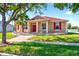 Charming single-Gathering home with red shutters and a matching red front door and a landscaped front yard at 3174 Grasmere View Pkwy, Kissimmee, FL 34746