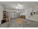 Spacious two car garage with white brick walls at 3174 Grasmere View Pkwy, Kissimmee, FL 34746