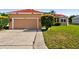 A single Gathering home with a two car garage, solar panels, and a well maintained lawn at 3174 Grasmere View Pkwy, Kissimmee, FL 34746