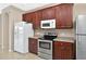 Modern kitchen with stainless steel appliances and ample cabinet space at 3174 Grasmere View Pkwy, Kissimmee, FL 34746