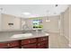 Kitchen showcasing countertops and a sink overlooking the adjacent Gathering room at 3174 Grasmere View Pkwy, Kissimmee, FL 34746