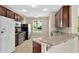 Well-equipped kitchen with stainless steel appliances and dark wood cabinetry at 3174 Grasmere View Pkwy, Kissimmee, FL 34746