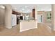 Open kitchen with stainless appliances and tile flooring that opens to living spaces at 3174 Grasmere View Pkwy, Kissimmee, FL 34746