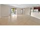 Spacious living room with tile flooring, neutral walls, sliding glass doors, and plenty of natural light at 3174 Grasmere View Pkwy, Kissimmee, FL 34746