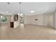 Bright, open living area with tile floors and natural light streaming through the windows at 3174 Grasmere View Pkwy, Kissimmee, FL 34746