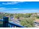 Scenic view of the community, featuring lush greenery, palm trees and distant views of the Wheel at 4013 Breakview Dr # A407, Orlando, FL 32819