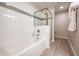 Bright bathroom featuring a tub with shower and modern fixtures at 4013 Breakview Dr # A407, Orlando, FL 32819
