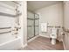 Accessible bathroom featuring a walk-in shower with glass doors and grab bars for enhanced safety at 4013 Breakview Dr # A407, Orlando, FL 32819