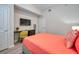 Comfortable bedroom with desk, TV, and contemporary design at 4013 Breakview Dr # A407, Orlando, FL 32819