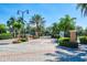 A beautiful gated community entrance with palm trees and lush landscaping, offering a secure and welcoming atmosphere at 4013 Breakview Dr # A407, Orlando, FL 32819