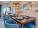 Chic dining room featuring a wood table with seating for six and stylish light fixture at 4013 Breakview Dr # A407, Orlando, FL 32819
