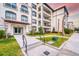 Condominium building with well-maintained landscaping, a welcoming entrance, and convenient access for residents at 4013 Breakview Dr # A407, Orlando, FL 32819