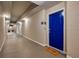 Bright condo hallway with unit door, welcome mat, and modern lighting at 4013 Breakview Dr # A407, Orlando, FL 32819