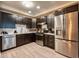 Well-equipped kitchen featuring stainless steel appliances, sleek cabinets, and ample counter space at 4013 Breakview Dr # A407, Orlando, FL 32819