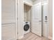 Laundry area featuring a modern washing machine and convenient storage space at 4013 Breakview Dr # A407, Orlando, FL 32819