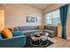 Comfortable living room featuring a plush sectional sofa, a cozy chair, and stylish decor at 4013 Breakview Dr # A407, Orlando, FL 32819