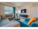 Cozy living room with comfortable seating, modern decor, and plenty of natural light at 4013 Breakview Dr # A407, Orlando, FL 32819