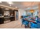 Inviting living area with a dining table and kitchen area. Includes stainless appliances and modern finishes at 4013 Breakview Dr # A407, Orlando, FL 32819