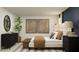Bright primary bedroom features decor, carpet, and lamps providing a relaxing space to unwind and rejuvenate at 4066 Old Mill Rd, Haines City, FL 33844