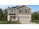 Charming two-story home with gray accents, shutters, and a two car garage at 4066 Old Mill Rd, Haines City, FL 33844