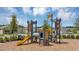 Community playground with castle themed equipment, a slide and climbing structures in a new community at 4066 Old Mill Rd, Haines City, FL 33844