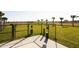 Community dog park featuring green space, secure fencing, and waste disposal stations at 4070 Old Mill Rd, Haines City, FL 33844