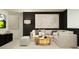 Inviting living area features a comfortable sectional sofa, modern artwork, and minimalist decor creating a relaxing atmosphere at 4082 Old Mill Rd, Haines City, FL 33844