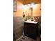 Updated half-bath with a new vanity, stylish fixtures and a modern design at 410 5Th S St, Dundee, FL 33838