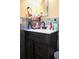 Modern bathroom vanity with dark wood cabinets, white countertop, and stylish fixtures at 410 5Th S St, Dundee, FL 33838