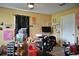 A modern office set-up with desk, shelves and equipment for both work and leisure at 410 5Th S St, Dundee, FL 33838