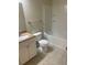 Clean bathroom featuring a vanity with granite countertops, a toilet, and a shower-tub combination at 417 Southern Pecan Cir # 201, Winter Garden, FL 34787