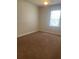Comfortable bedroom bathed in natural light from the large window, ideal for relaxation at 417 Southern Pecan Cir # 201, Winter Garden, FL 34787
