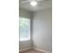 Cozy bedroom with a window and a ceiling fan, offering natural light and a comfortable atmosphere at 417 Southern Pecan Cir # 201, Winter Garden, FL 34787