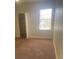 Bright bedroom with a window and closet providing ample natural light and storage space at 417 Southern Pecan Cir # 201, Winter Garden, FL 34787