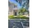 Inviting home exterior featuring a well-maintained lawn and assigned parking spaces at 417 Southern Pecan Cir # 201, Winter Garden, FL 34787