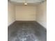A spacious, empty garage awaits your vehicles and storage needs at 417 Southern Pecan Cir # 201, Winter Garden, FL 34787