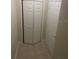 Tiled hallway featuring a closet and white interior doors at 417 Southern Pecan Cir # 201, Winter Garden, FL 34787