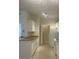 Bright kitchen featuring white cabinetry, tile floors, and modern appliances, great for cooking and entertaining at 417 Southern Pecan Cir # 201, Winter Garden, FL 34787