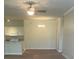 Inviting living space with a modern kitchen, dining area, and cozy seating arrangement at 417 Southern Pecan Cir # 201, Winter Garden, FL 34787