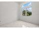 Bright bedroom with large windows offering a serene view at 4528 Yorkshire Ln, Kissimmee, FL 34758