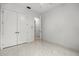 White bedroom features a closet and neutral flooring at 4528 Yorkshire Ln, Kissimmee, FL 34758