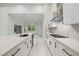 Modern kitchen featuring quartz countertops and sleek stainless steel appliances at 4528 Yorkshire Ln, Kissimmee, FL 34758