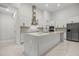 Elegant kitchen with stainless steel appliances and a large center island at 4528 Yorkshire Ln, Kissimmee, FL 34758