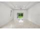 Bright living room featuring recessed lighting, sliding glass doors and polished marble flooring at 4528 Yorkshire Ln, Kissimmee, FL 34758