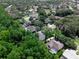 High-angle view of a home with mature trees and a screened-in pool in a quiet residential community at 460 W Palm Valley Dr, Oviedo, FL 32765