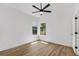 Bedroom with hard wood floors and natural light through windows at 460 W Palm Valley Dr, Oviedo, FL 32765