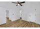 Bedroom with hard wood floors with an ensuite bathroom and walk-in closet at 460 W Palm Valley Dr, Oviedo, FL 32765