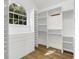 Walk-in closet features custom shelving, drawers, and plenty of space with a window at 460 W Palm Valley Dr, Oviedo, FL 32765