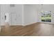 Bright living room with hardwood floors and a large window offering natural light and an open floor plan at 460 W Palm Valley Dr, Oviedo, FL 32765